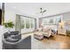 Large main bedroom with sitting area and neutral color palette at 832 Heather Ln, Charlotte, NC 28209