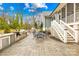 Outdoor patio with built-in grill and dining area at 832 Heather Ln, Charlotte, NC 28209