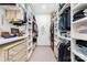 Large walk-in closet with ample shelving and hanging space at 832 Heather Ln, Charlotte, NC 28209