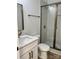 Modern bathroom featuring glass-enclosed shower and vanity at 8823 Wingard Rd, Waxhaw, NC 28173