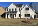 New construction two-story home with white siding, black accents, and a well-manicured lawn at 8823 Wingard Rd, Waxhaw, NC 28173