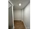 Hallway with wood-look floors and neutral walls at 8823 Wingard Rd, Waxhaw, NC 28173