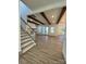 Inviting living room featuring wood beams, a fireplace, hardwood floors, and access to the backyard at 8823 Wingard Rd, Waxhaw, NC 28173