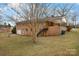 All brick house featuring a garage, a patio space, a backyard, and exterior stairs at 925 37Th Sw St, Hickory, NC 28602