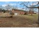 Rear view of brick house, patio, garage, and staircase at 925 37Th Sw St, Hickory, NC 28602