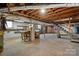 Large unfinished basement with exposed utilities and work area at 925 37Th Sw St, Hickory, NC 28602