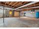 Unfinished basement with exposed beams and ample open space at 925 37Th Sw St, Hickory, NC 28602