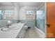 Clean bathroom featuring a tiled shower and well-lit mirror at 925 37Th Sw St, Hickory, NC 28602