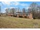 Classic red brick ranch home with a dark roof and a well maintained lawn in a suburban setting at 925 37Th Sw St, Hickory, NC 28602