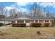 Charming brick ranch-style house featuring a covered entry and white trim accents at 925 37Th Sw St, Hickory, NC 28602