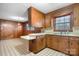 Retro kitchen with wood cabinets, vintage appliances, and a view into the dining room at 925 37Th Sw St, Hickory, NC 28602