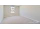 Spacious bedroom featuring neutral decor and plush carpeting at 9835 Old Garden Cir, Gastonia, NC 28056