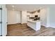 Modern kitchen with island and white cabinetry at 9835 Old Garden Cir, Gastonia, NC 28056