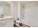 Clean bathroom with white vanity, tub, and shower at 9839 Old Garden Cir, Gastonia, NC 28056