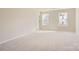 Spacious bedroom with neutral carpeting and large windows at 9839 Old Garden Cir, Gastonia, NC 28056