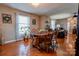 Bright dining room features hardwood floors and a charming wooden table at 116 Country Creek Dr, Kings Mountain, NC 28086