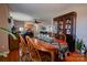 Dining area with hardwood floors and a wooden table, view to living room at 116 Country Creek Dr, Kings Mountain, NC 28086