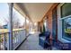 Relaxing front porch with white railings and wicker seating at 116 Country Creek Dr, Kings Mountain, NC 28086