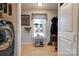 Bright laundry room with washer, dryer, and ample storage at 116 Country Creek Dr, Kings Mountain, NC 28086