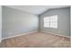 Bright bedroom with neutral walls and carpet at 123 Neill Estate Ln, Mooresville, NC 28117