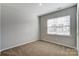 Well-lit bedroom with neutral walls and carpet at 123 Neill Estate Ln, Mooresville, NC 28117