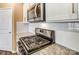 Stainless steel range and microwave in a white kitchen at 123 Neill Estate Ln, Mooresville, NC 28117