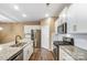 Modern kitchen with stainless steel appliances and granite countertops at 123 Neill Estate Ln, Mooresville, NC 28117