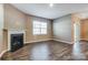 Living room with hardwood floors and a gas fireplace at 123 Neill Estate Ln, Mooresville, NC 28117