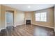 Living room featuring hardwood floors and a fireplace at 123 Neill Estate Ln, Mooresville, NC 28117