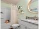 Light green bathroom with bathtub, shower, and shelving at 1259 Amberlight Cir, Salisbury, NC 28144