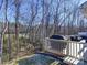 Deck overlooks a wooded area with a view of a golf course at 1259 Amberlight Cir, Salisbury, NC 28144