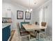 Bright dining room with a light-toned table and four chairs at 1259 Amberlight Cir, Salisbury, NC 28144