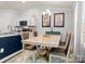 Elegant dining area features a table for four and stylish light fixture at 1259 Amberlight Cir, Salisbury, NC 28144