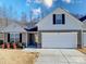 Two-story house with gray siding, white accents, and a two-car garage at 1259 Amberlight Cir, Salisbury, NC 28144