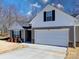 Two-story house with gray siding, white accents, and a two-car garage at 1259 Amberlight Cir, Salisbury, NC 28144