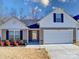 Two-story home with a neutral color scheme and a two-car garage at 1259 Amberlight Cir, Salisbury, NC 28144