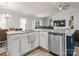 Island kitchen with stainless steel dishwasher and granite countertops at 1259 Amberlight Cir, Salisbury, NC 28144