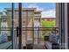 Private balcony offering city views and outdoor seating at 1315 East Blvd # 420, Charlotte, NC 28203