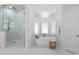 Luxurious bathroom with soaking tub, walk-in shower, and marble flooring at 13505 Evening Primrose Dr, Davidson, NC 28036