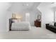 Bedroom with double bed and wooden dresser, offering a cozy atmosphere at 13505 Evening Primrose Dr, Davidson, NC 28036