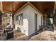 Covered porch with stone flooring, a swing, and wicker chairs at 13505 Evening Primrose Dr, Davidson, NC 28036