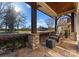 Relaxing front porch with stone flooring and a porch swing at 13505 Evening Primrose Dr, Davidson, NC 28036