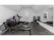 Home gym with rowing machine, treadmill, and weight equipment at 13505 Evening Primrose Dr, Davidson, NC 28036