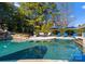 Stunning pool with a spacious seating area and fire pit at 13505 Evening Primrose Dr, Davidson, NC 28036