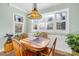 Charming breakfast nook with wood table and chairs, perfect for enjoying morning meals at 13924 Island Dr, Huntersville, NC 28078