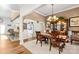 Bright dining area with hardwood floors and kitchen view at 13924 Island Dr, Huntersville, NC 28078