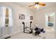 Bright home gym with weight bench, barbell, and additional exercise equipment at 13924 Island Dr, Huntersville, NC 28078