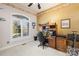 Home office with built-in wooden desk and window looking out to the street at 13924 Island Dr, Huntersville, NC 28078