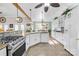 Modern kitchen with white cabinets, granite countertops, and stainless steel appliances at 13924 Island Dr, Huntersville, NC 28078