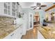 Kitchen boasts granite countertops and white cabinetry with ample storage space at 13924 Island Dr, Huntersville, NC 28078